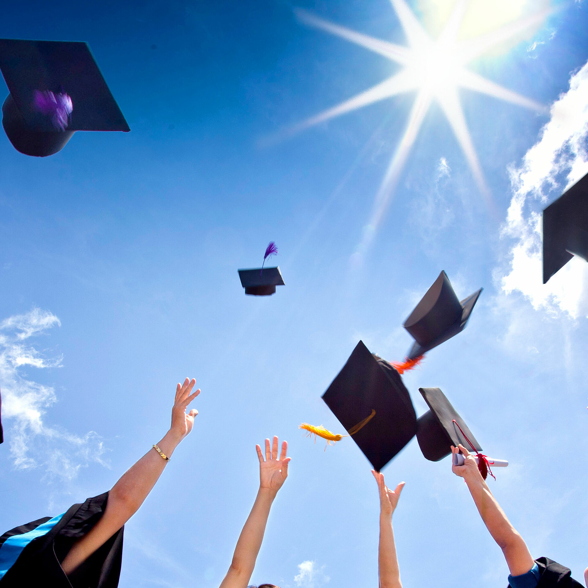 Students throwing hats in the air