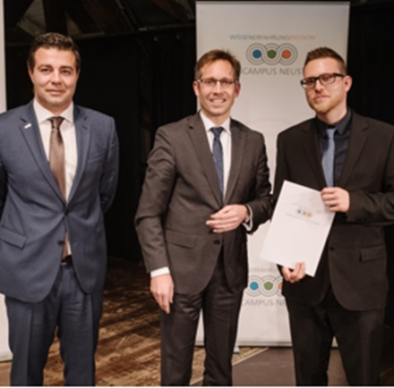 Three gentlemen in suits at the presentation of certificates